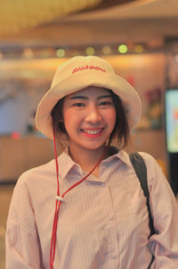 Portrait of smiling woman in hat