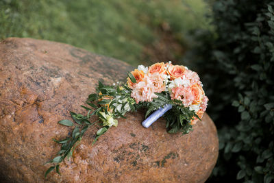 High angle view of bouquet on stone