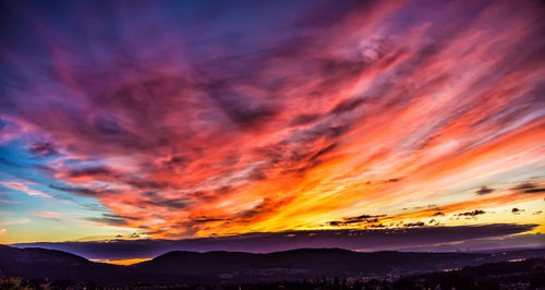 Scenic view of dramatic sky during sunset