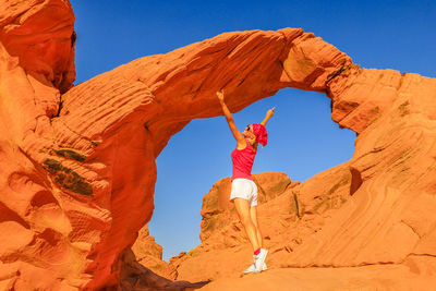 Low angle view of rock formation against sky