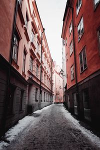 Street amidst buildings during winter