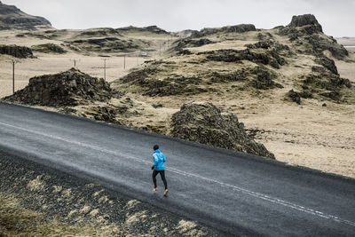 Man jogging in mountains  on the move