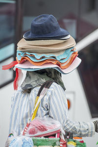 Rear view of person wearing hat