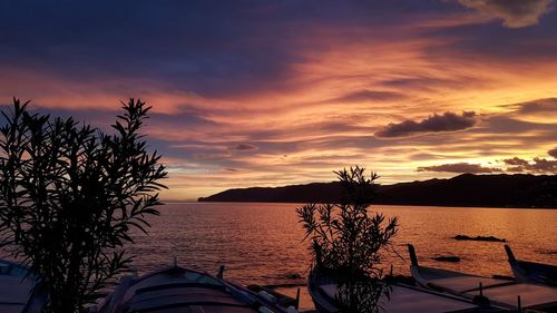 Scenic view of sea against orange sky