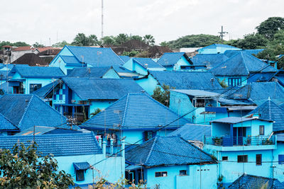 High angle view of townscape against blue sky