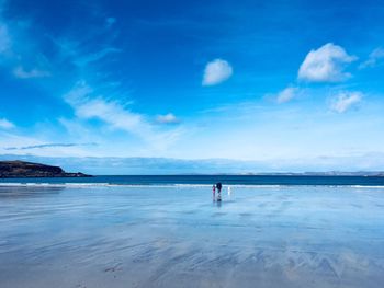 Scenic view of sea against blue sky