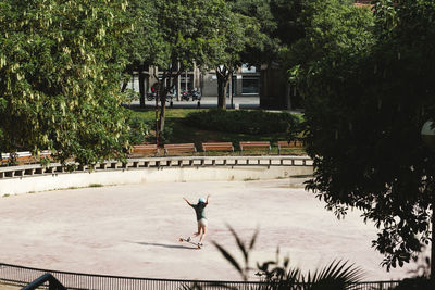 High angle view of woman skateboarding at park