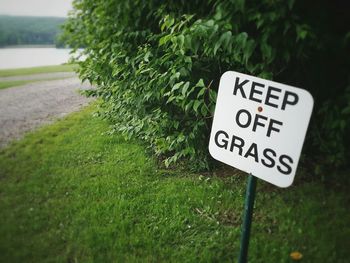 Close-up of text on grass