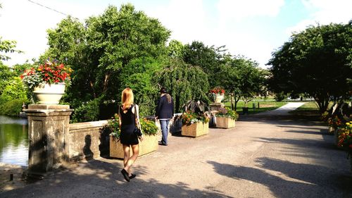 Man standing on tree trunk