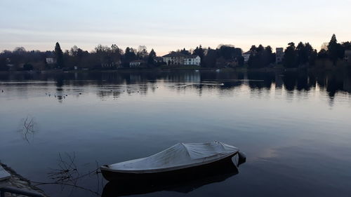 Scenic view of lake against sky during sunset