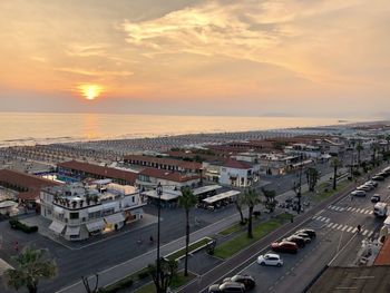 High angle view of city at sunset