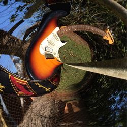 High angle view of guitar in water