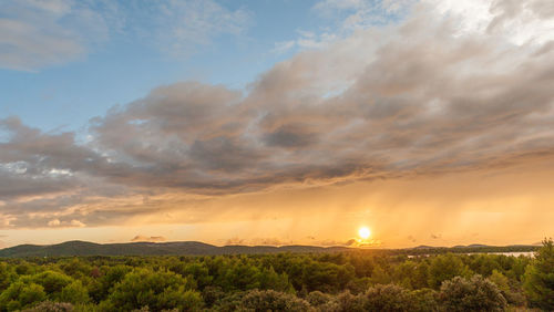 Scenic view of landscape against sky during sunset