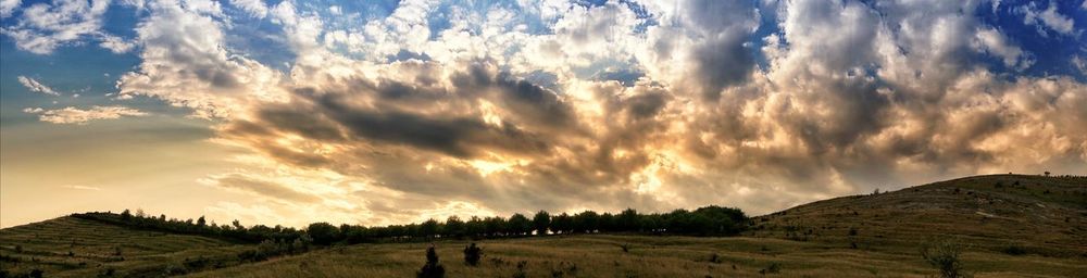 Panoramic view of landscape against sky during sunset