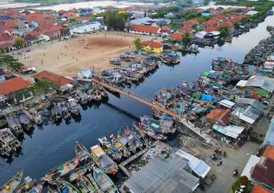 Beautiful aerial view of boats lined up in a fishing village, in cirebon, west java - indonesia.