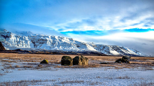 Scenic view of snowcapped mountains against sky