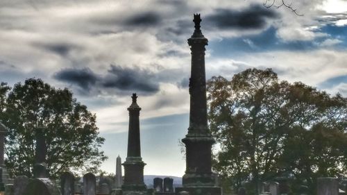 Low angle view of statue against cloudy sky