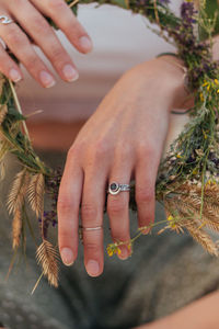 Cropped image of man holding plant