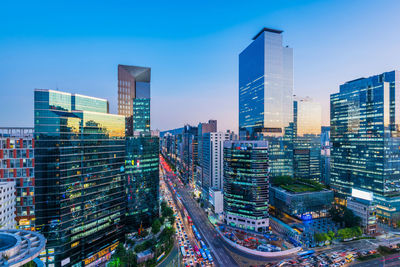 High angle view of illuminated buildings in city against sky