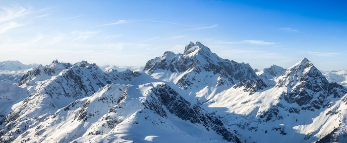 Scenic view of snowcapped mountains against sky