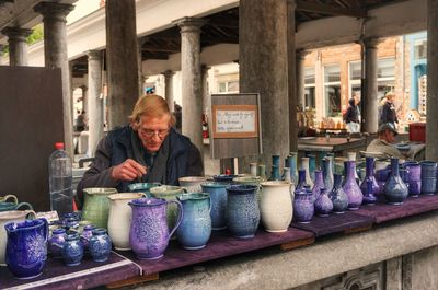 Man having food at market stall