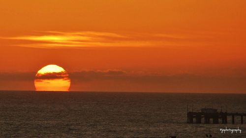 Scenic view of sea at sunset