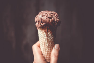 Close-up of hand holding ice cream