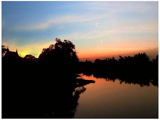 silhouette, sunset, tranquil scene, tranquility, water, sky, scenics, beauty in nature, transfer print, tree, lake, reflection, nature, auto post production filter, idyllic, dusk, cloud, calm, cloud - sky, waterfront