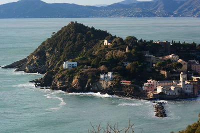 High angle view of sea and buildings against sky