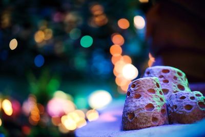 Close-up of illuminated christmas lights at night