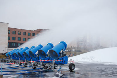 People in snow against sky during winter