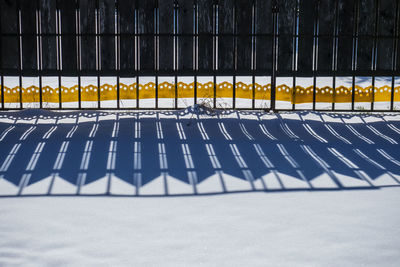 Wooden rustic fence in winter