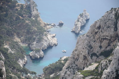 High angle view of rocks by sea