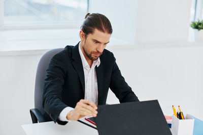 Young man working on table