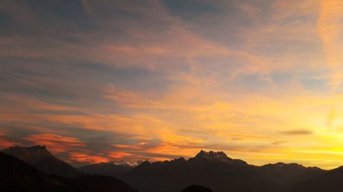 Scenic view of mountains against dramatic sky
