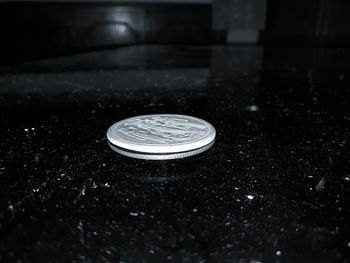 Close-up of coins on table