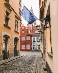 Street amidst buildings against sky