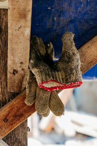 Close-up of stuffed toy hanging on wood