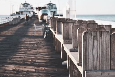 View of pier over sea against clear sky