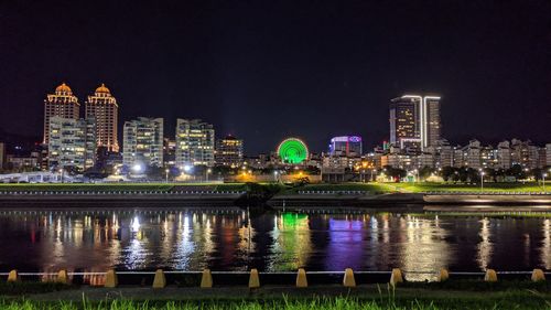 Illuminated buildings in city at night
