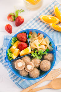 High angle view of fruits in plate on table