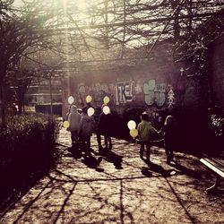 Woman walking on footpath