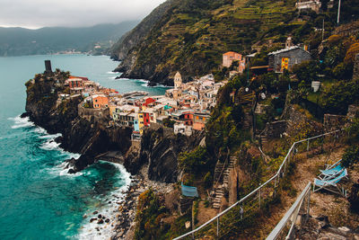 High angle view of sea and buildings in city