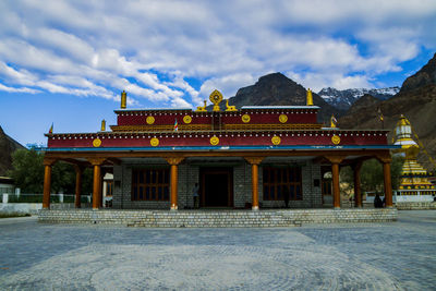 Building against cloudy sky during winter