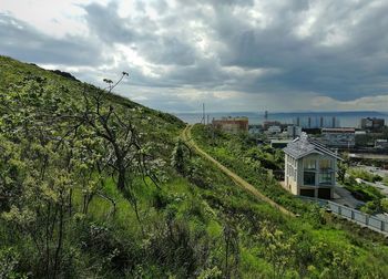 High angle view of trees and buildings against sky