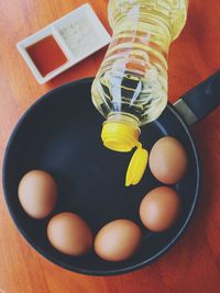 High angle view of eggs in container on table