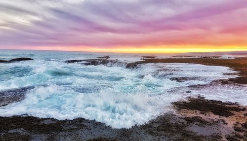 Scenic view of sea against sky during sunset