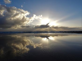 Scenic view of sea against sky at sunset