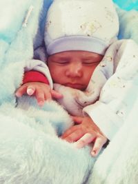 Baby girl lying on bed