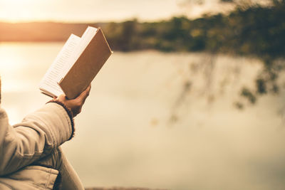Close-up of hand holding book